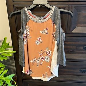 Junior long sleeve shirt with open shoulder. Size L